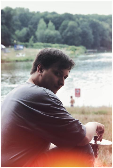 A man enjoying a peaceful moment by a scenic river