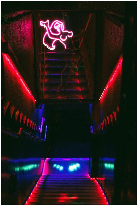 Stylish neon-lit stairway featuring a bright red n