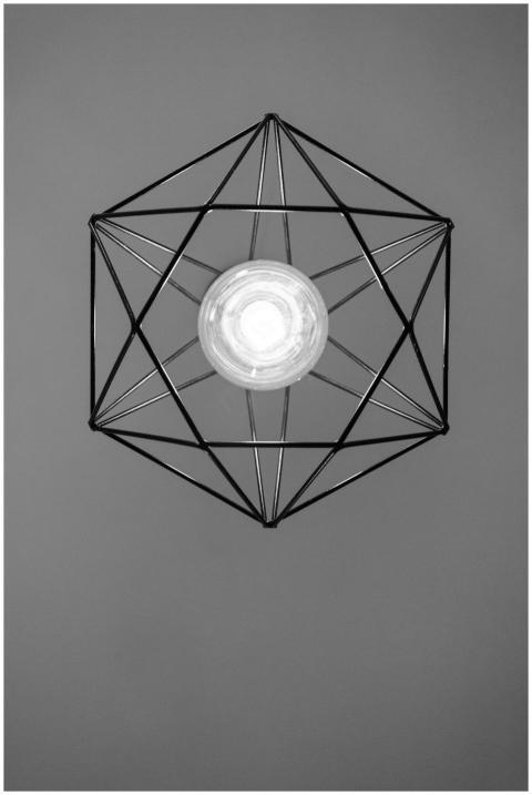 A minimalist black and white image of a geometric