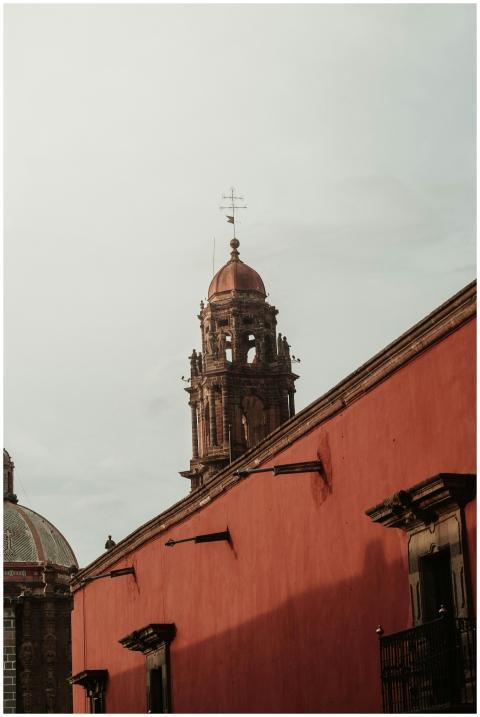 Bell tower against a cloudy sky in San Miguel de A
