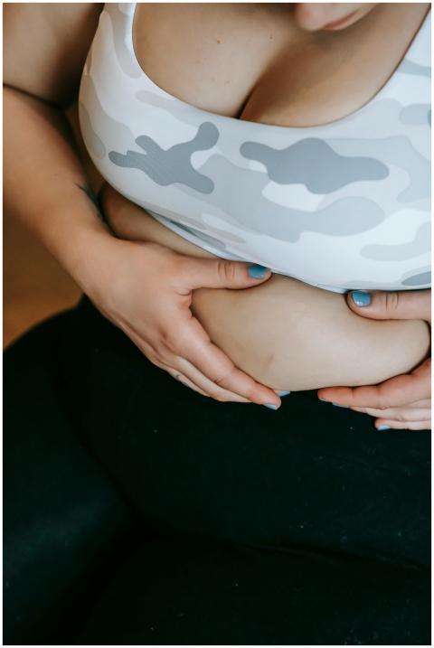 Cropped view of a woman embracing body positivity