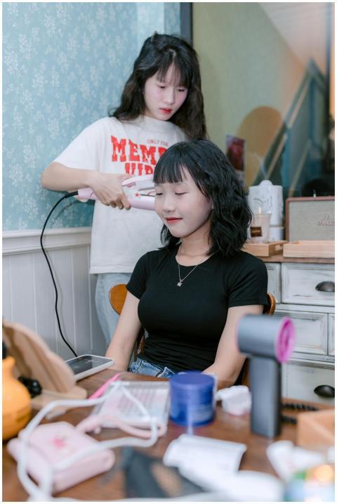 Young Woman Having Hair