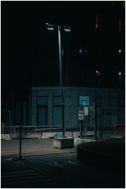 Moody night scene with streetlamp lighting a deser