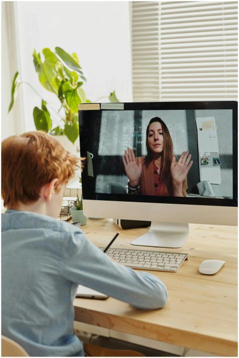 A child participates in online learning through a