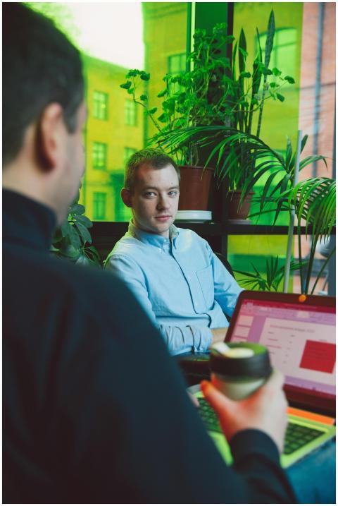 Two business professionals discussing plans in a v