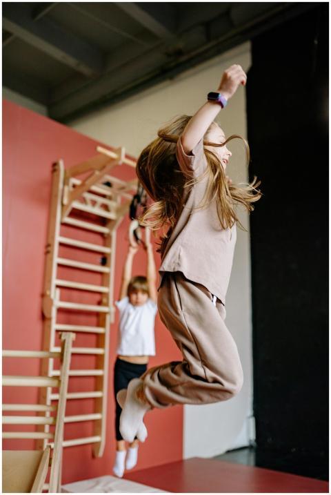 Kids having fun and keeping active by jumping in a