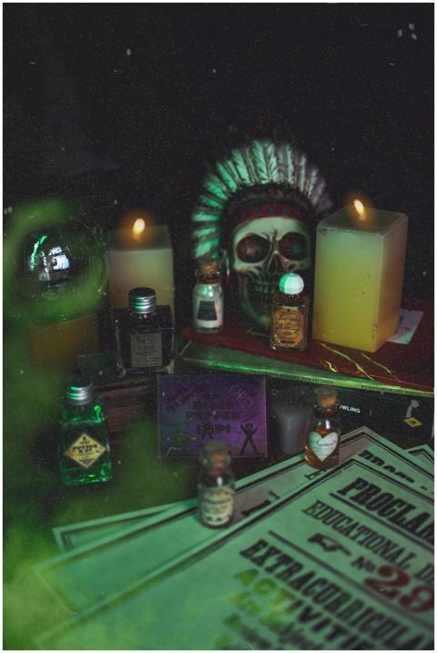 Eerie atmosphere with candles, skull, and mystical