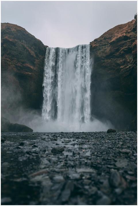 Stunning view of Skógafoss waterfall cascading in