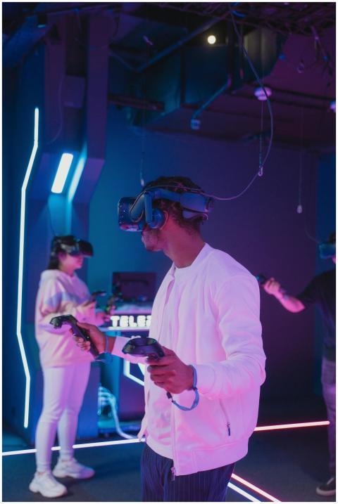 Group enjoying immersive VR gaming indoors with he