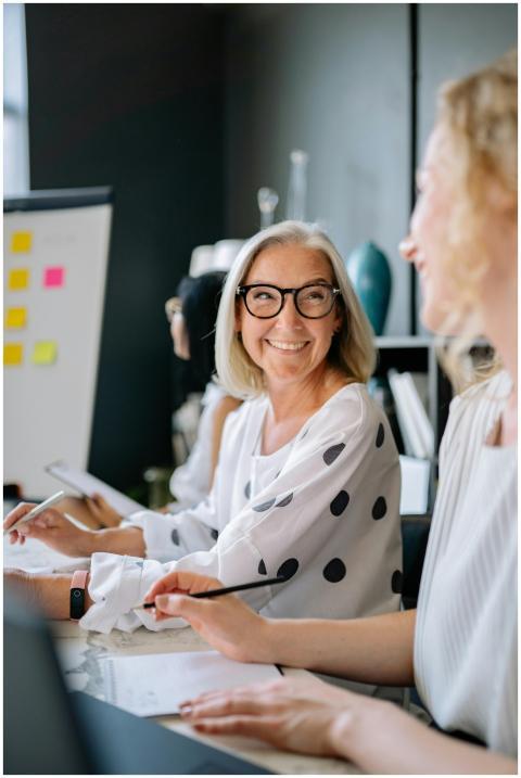 Two women engaged in a positive business meeting d