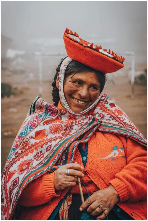 Smiling woman in vibrant traditional Peruvian atti