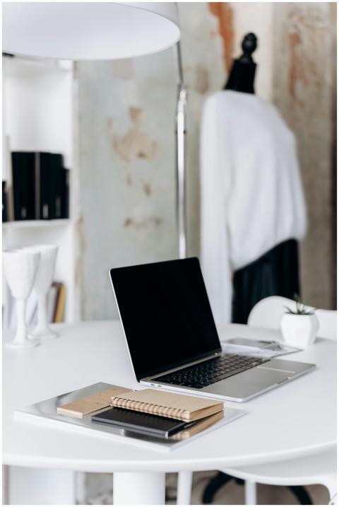 A minimalistic workspace featuring a laptop and no