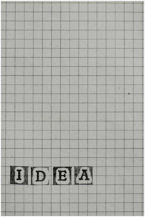Minimalist grid paper with stamped typography spel