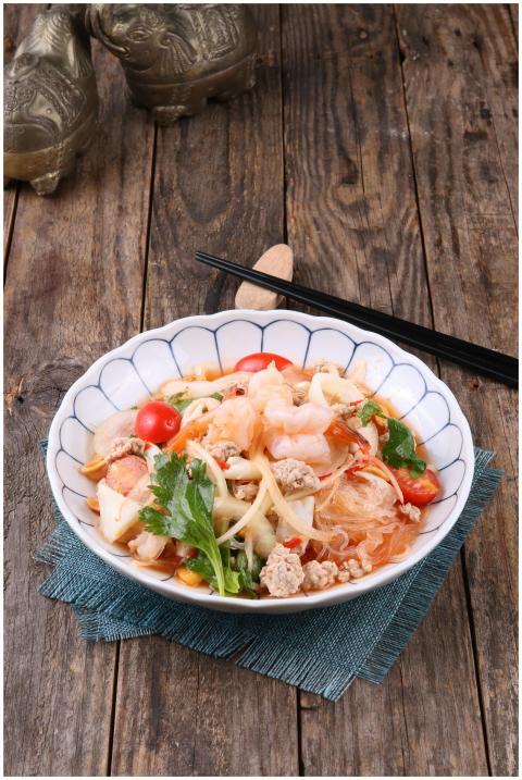Authentic Thai salad with prawns, noodles, and fre