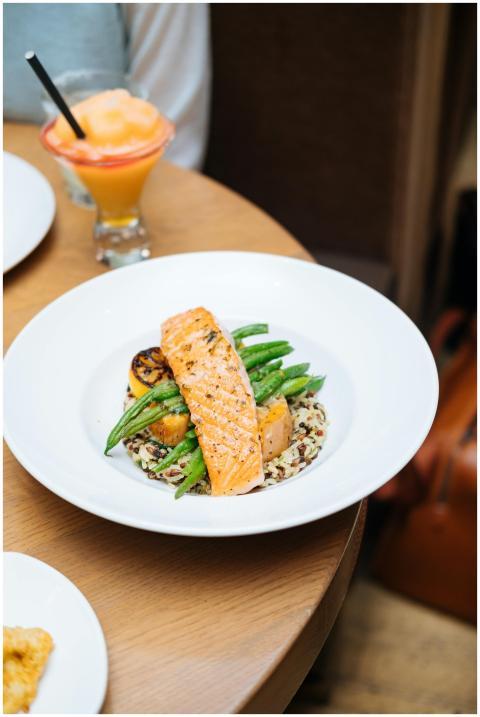 Grilled salmon served with quinoa, asparagus, and