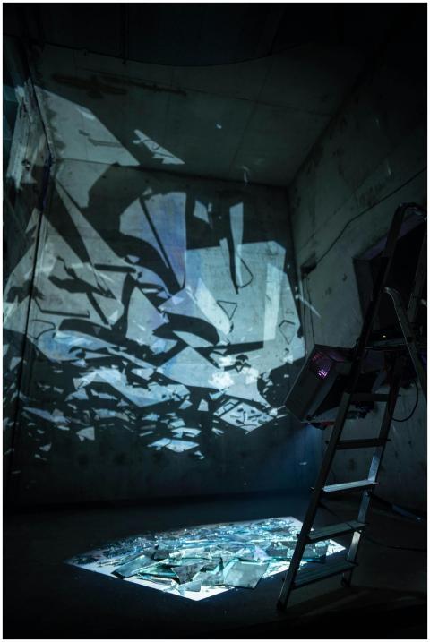 Broken glass and light reflections create abstract