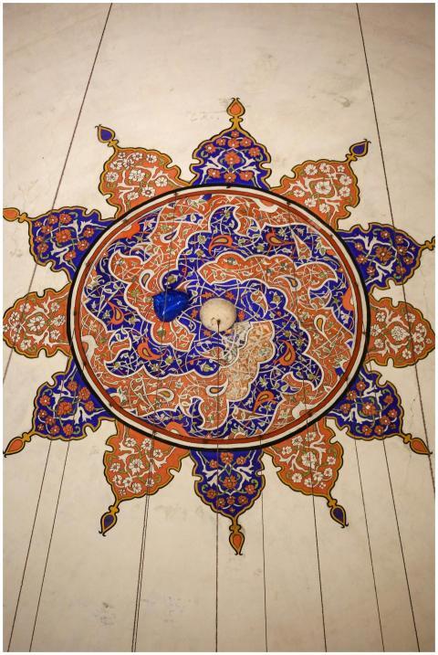 Detailed view of Islamic geometric design on a cei