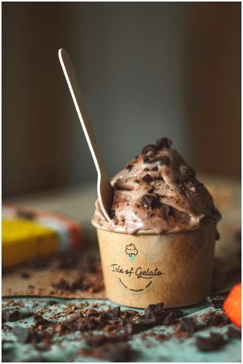 Close-up of chocolate gelato in a branded cup with