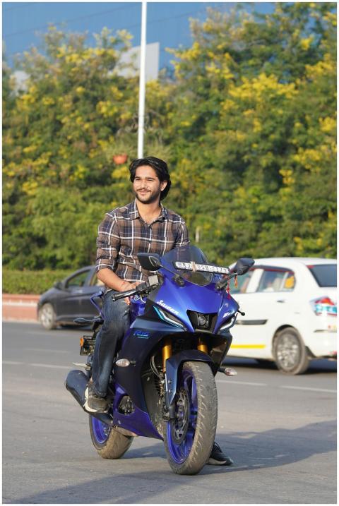 Young Man Riding Blue