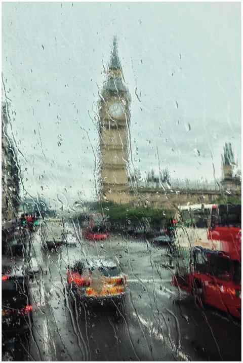 Moody view of Big Ben through a rain-soaked window