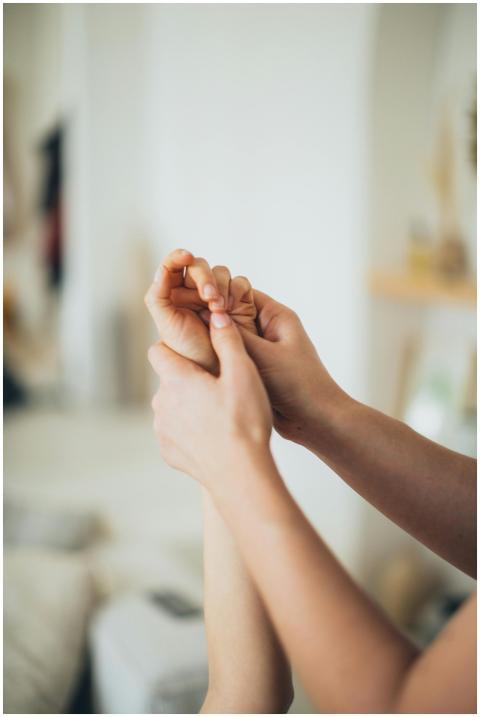 Close-up of hands giving a soothing massage, promo