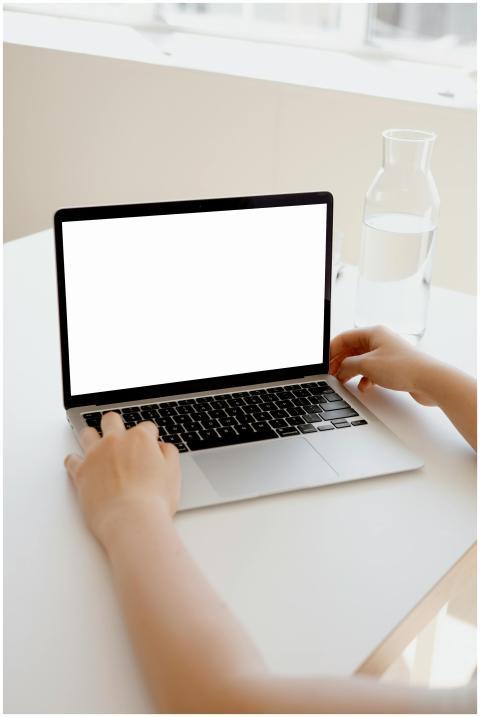 A clean, modern workspace featuring a laptop with