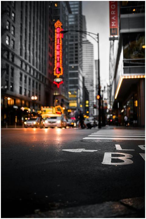 Dynamic cityscape at night with illuminated signs,