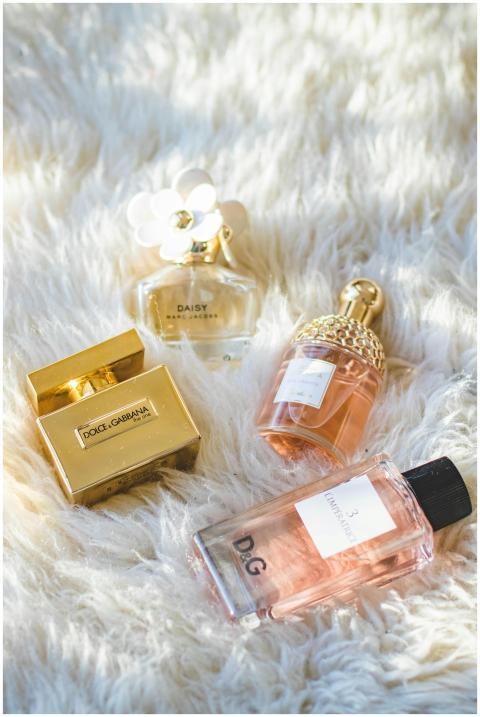 A collection of elegant perfume bottles arranged o