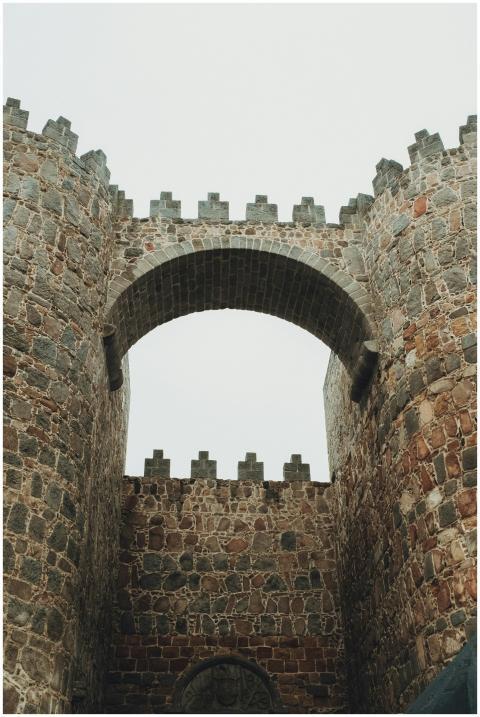 Historic stone arch and walls of Ávila Castle, Spa