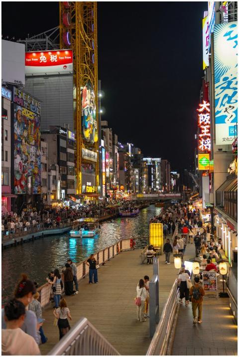 Bustling Dotonbori at night with vibrant lights an