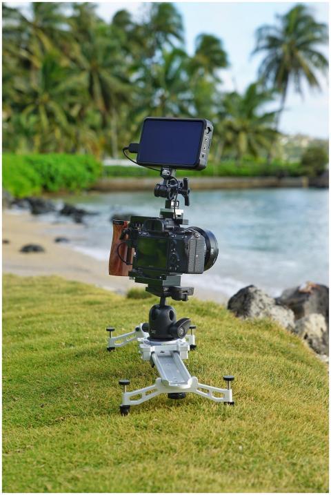 Camera on tripod by a tropical beach in Hawaii, ca