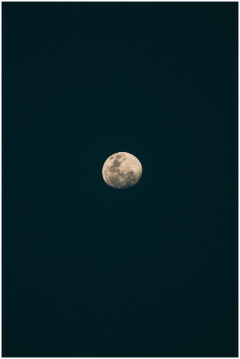 Captivating gibbous moon against a dark night sky,