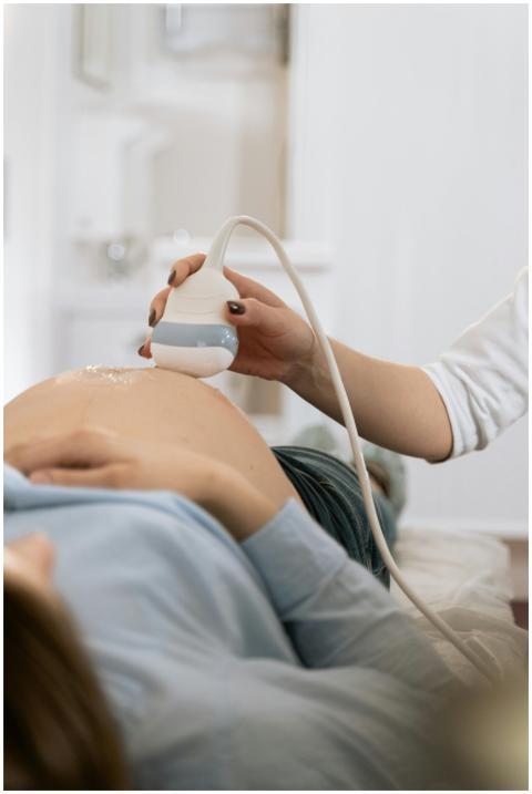 A pregnant woman undergoing a medical ultrasound i