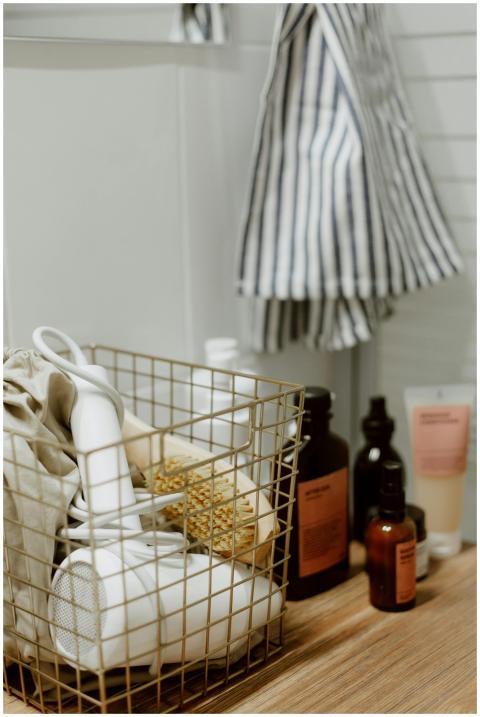 Close-up of a bathroom counter with a basket holdi