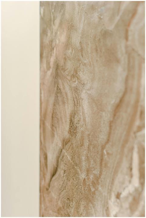Close-up of a beige marble surface with natural pa