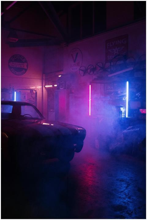 Atmospheric garage scene with neon lights illumina