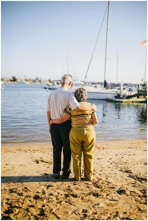 Senior couple embracing on a sunny beach. Perfect