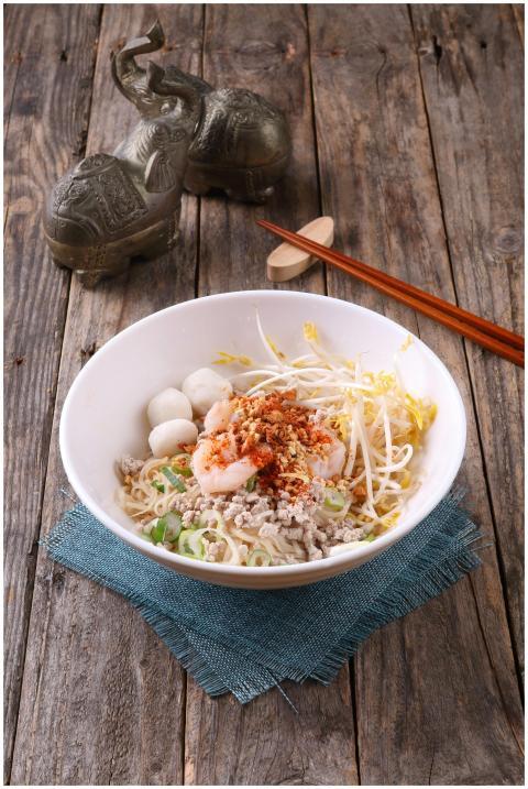 A beautifully presented Asian noodle dish with shr