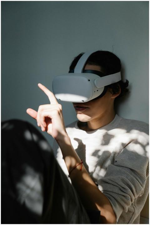 Man using a VR headset, immersed in a digital expe