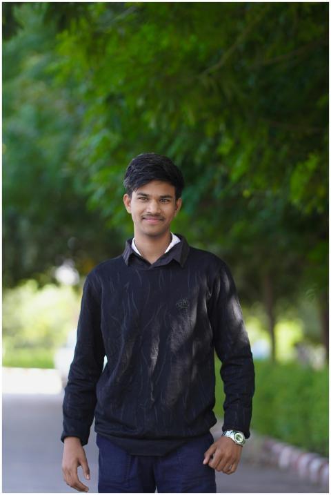 Young Man Smiling Outdoors