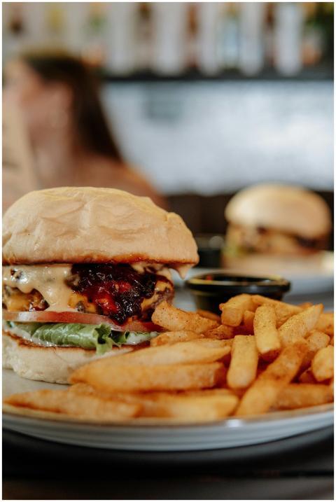 Delicious cheeseburger with fries, perfect for fas