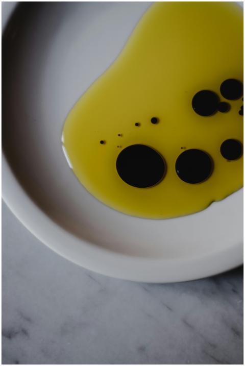 Artistic close-up of olive oil and balsamic vinega