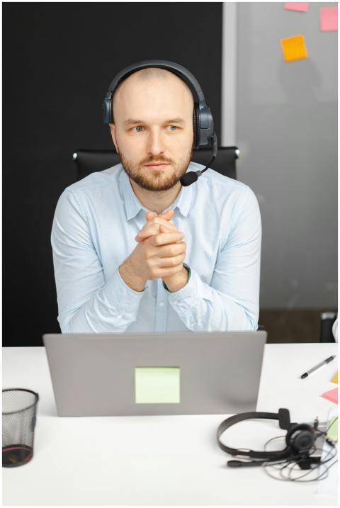 Business professional in call center with headset