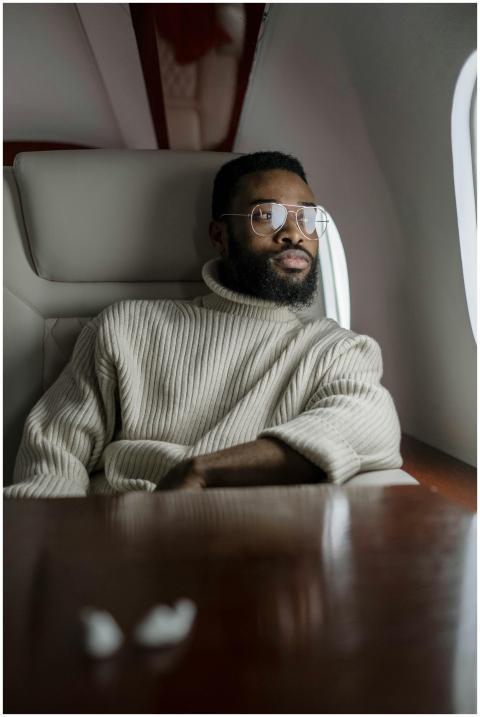 Businessman with a beard and glasses relaxing in a