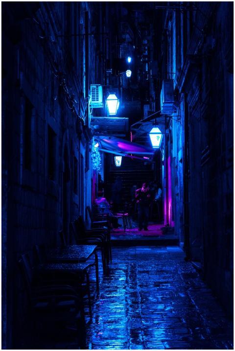 Atmospheric night scene of a city alley illuminate