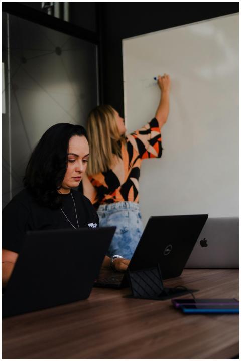 Two women engaged in a collaborative office worksp