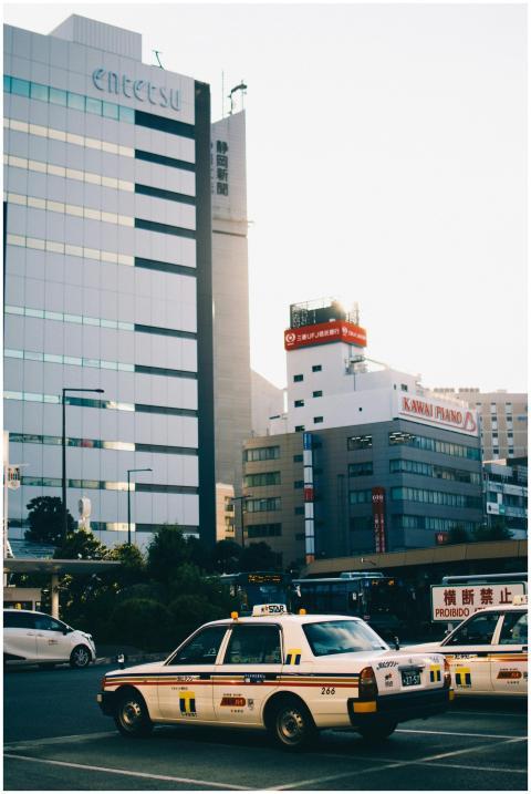 A serene urban landscape in Japan featuring taxis