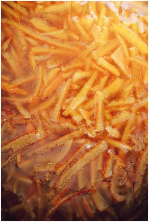 Close-up of golden french fries being deep fried t