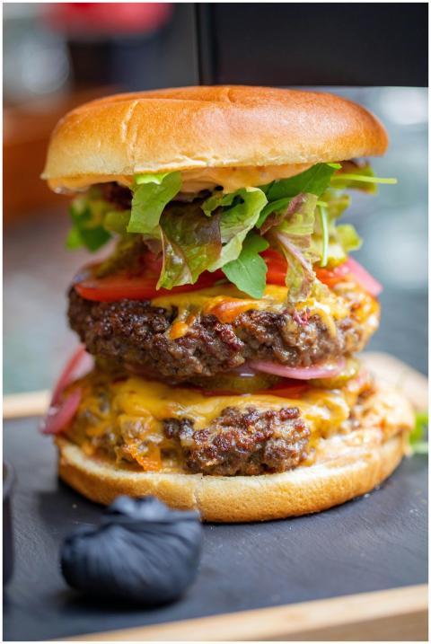 Scrumptious double cheeseburger with fresh topping