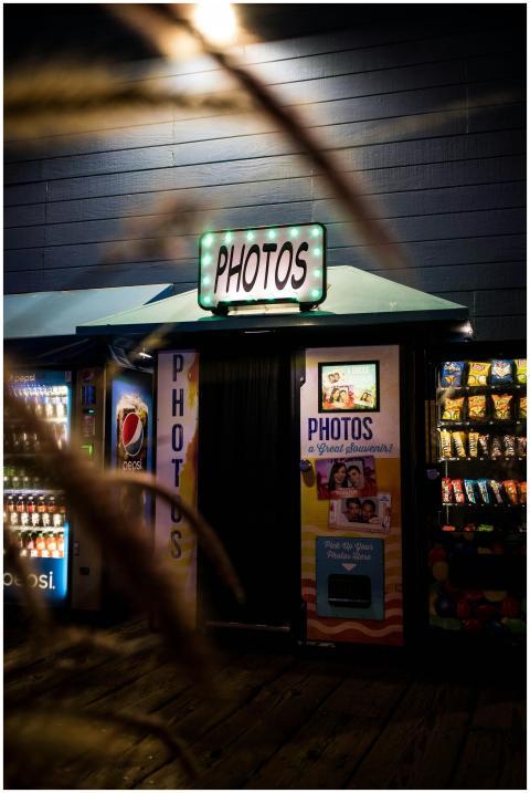 Vibrant photobooth and vending machines at night o